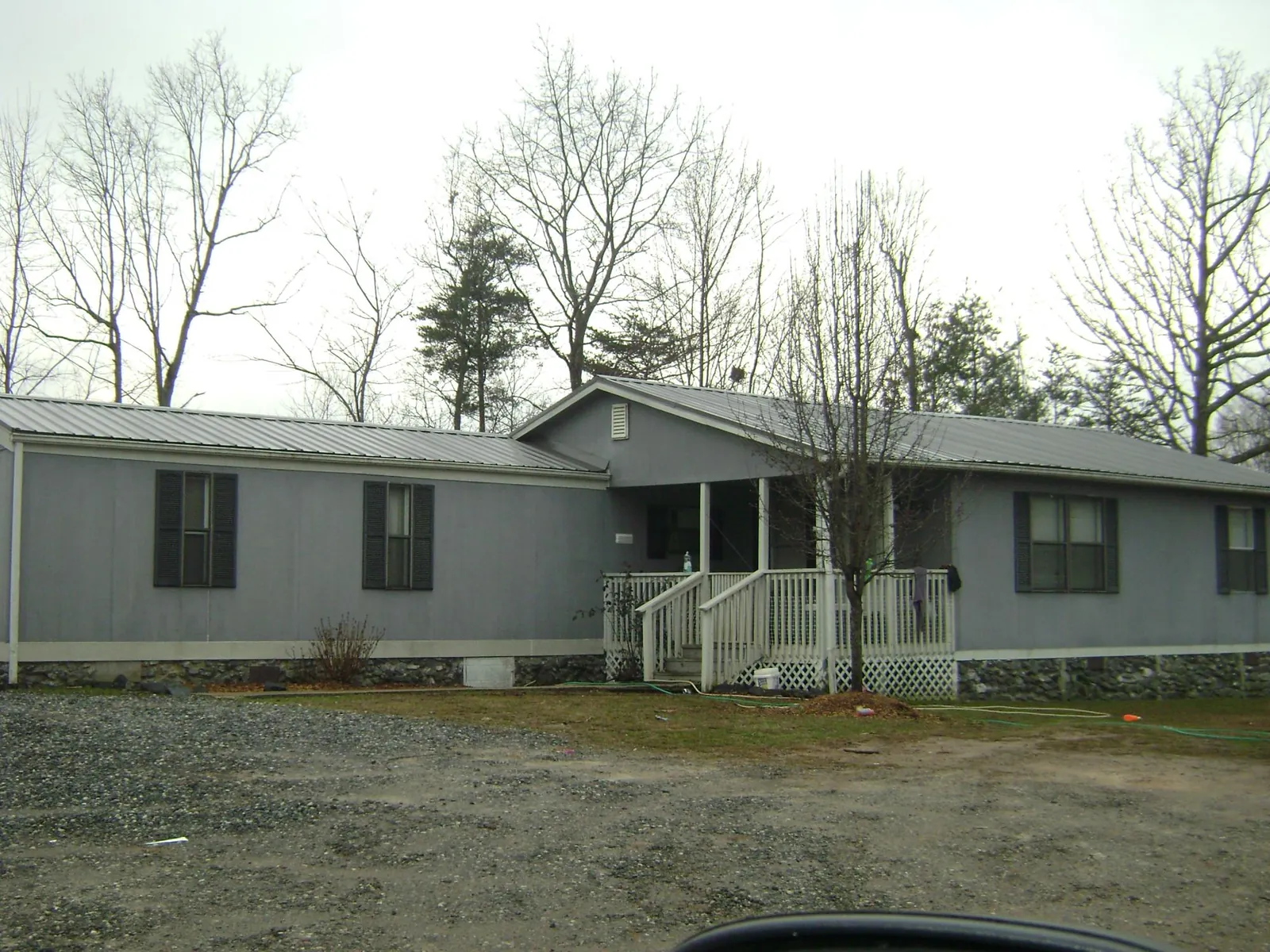 Metal roof over a manufactured home with a covered front porch in Fultonham